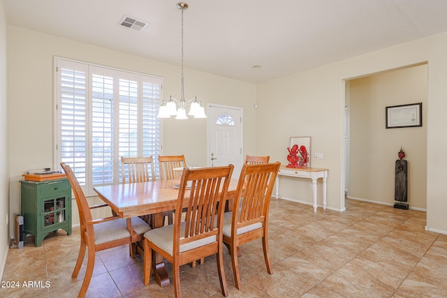 dining room with a notable chandelier