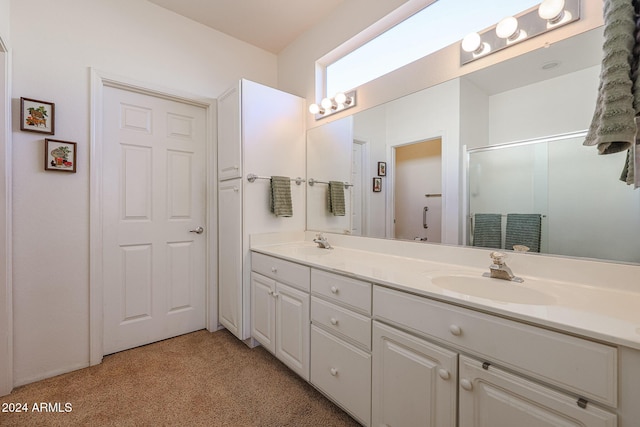 bathroom with vanity and an enclosed shower