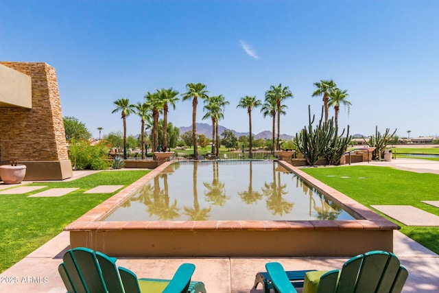 3755 E Hazeltine Way, Chandler, AZ 85249 - view of swimming pool featuring a mountain view and a lawn