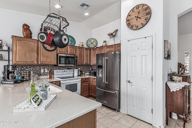 3755 E Hazeltine Way, Chandler, AZ 85249 - kitchen with appliances with stainless steel finishes, backsplash, arched walkways, light tile patterned floors, and high vaulted ceiling