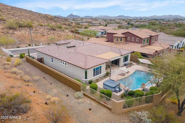 drone / aerial view featuring a residential view and a mountain view