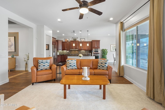 living room with ceiling fan, recessed lighting, wood finished floors, and baseboards