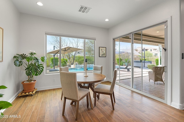 dining area featuring recessed lighting, visible vents, baseboards, and wood finished floors