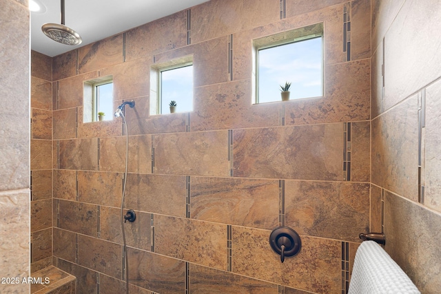 bathroom with a tile shower