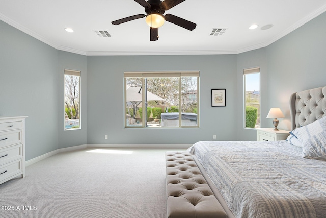 bedroom featuring multiple windows, visible vents, crown molding, and light colored carpet