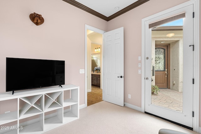 interior space with ornamental molding, carpet, and baseboards