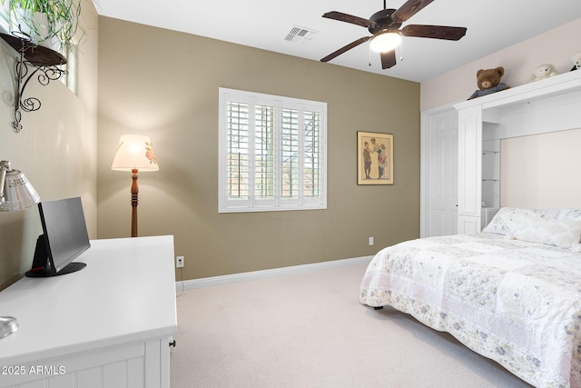 bedroom with baseboards, visible vents, a ceiling fan, carpet flooring, and a closet