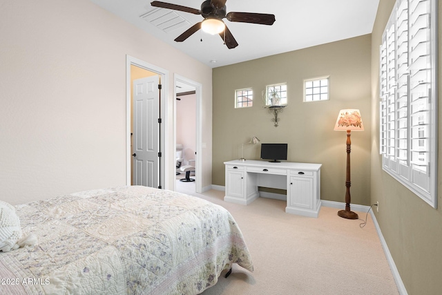 bedroom with a ceiling fan, multiple windows, light carpet, and baseboards