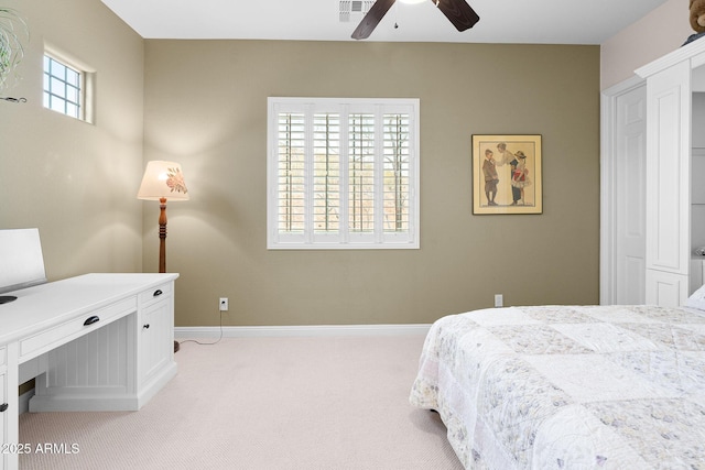 bedroom with baseboards, a ceiling fan, visible vents, and light colored carpet