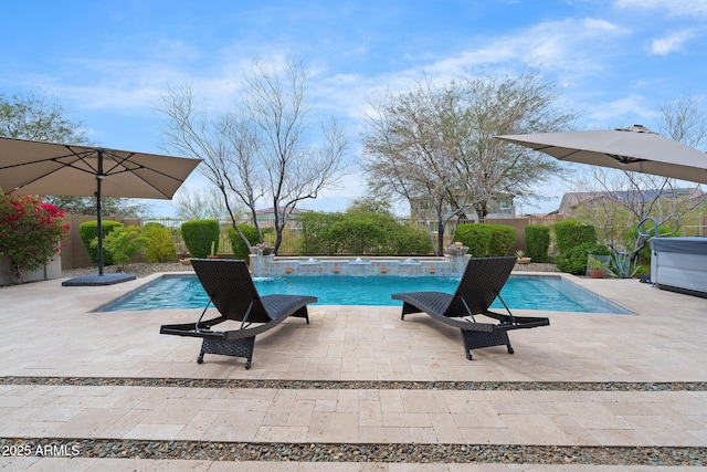 pool featuring a patio area, a hot tub, and a fenced backyard