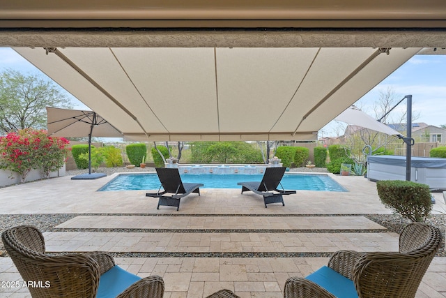 view of swimming pool with a fenced in pool, a patio, and a hot tub