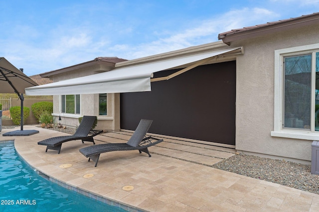 view of patio / terrace featuring a fenced in pool