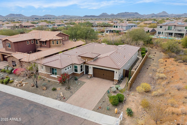 drone / aerial view with a mountain view and a residential view