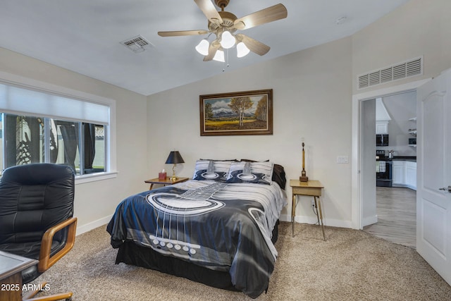 carpeted bedroom featuring ceiling fan and lofted ceiling