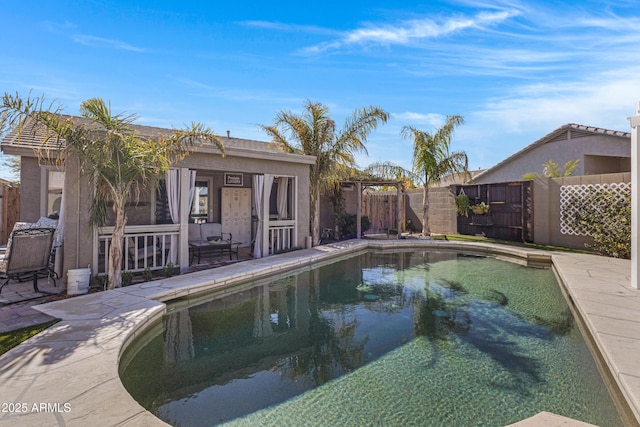 view of swimming pool with an outbuilding