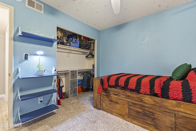 1927 E Hampton Ave Unit 204, Mesa, AZ 85204 - bedroom featuring carpet flooring, a closet, a ceiling fan, and a textured ceiling