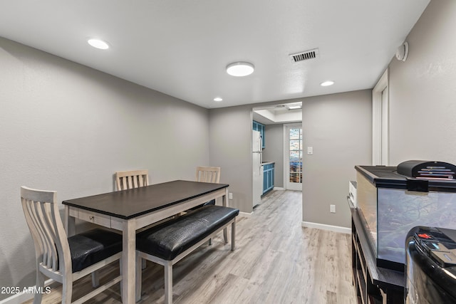1927 E Hampton Ave Unit 204, Mesa, AZ 85204 - dining room with light wood finished floors and recessed lighting