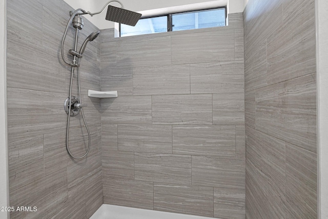 bathroom featuring tiled shower