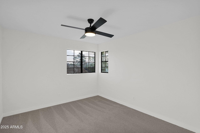 unfurnished room with carpet and ceiling fan