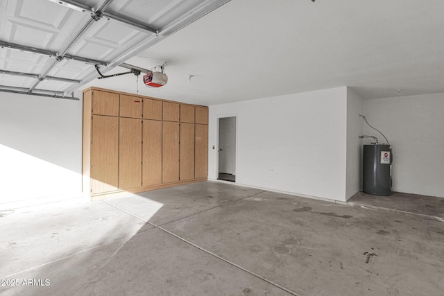 garage featuring water heater and a garage door opener