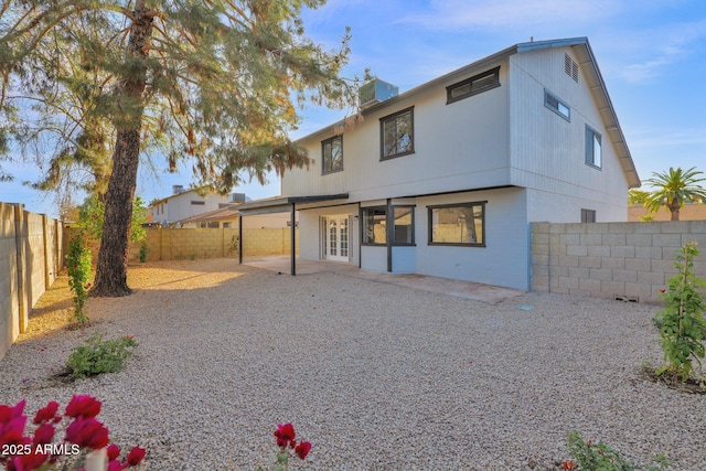 rear view of house with a patio and french doors