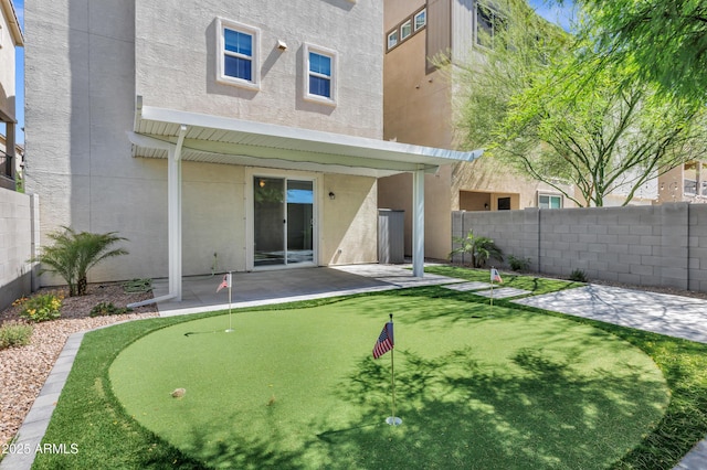 751 W Flintlock Way, Chandler, AZ 85286 - rear view of house with a patio area, stucco siding, a putting area, and a fenced backyard