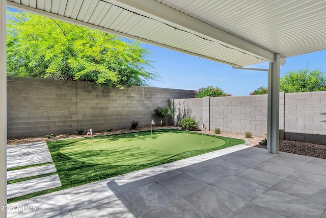 751 W Flintlock Way, Chandler, AZ 85286 - fenced backyard featuring a putting area and a patio