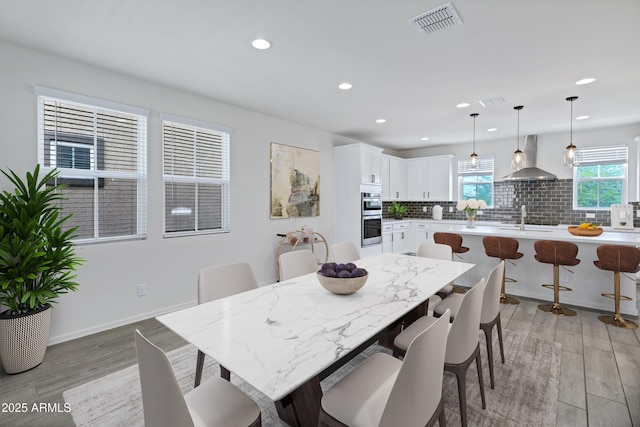 751 W Flintlock Way, Chandler, AZ 85286 - dining room with light wood-style floors, recessed lighting, and baseboards