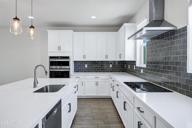 751 W Flintlock Way, Chandler, AZ 85286 - kitchen featuring a sink, appliances with stainless steel finishes, wall chimney exhaust hood, hanging light fixtures, and light countertops