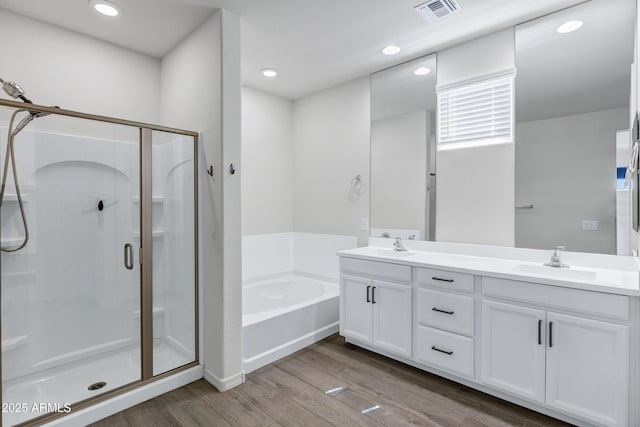 751 W Flintlock Way, Chandler, AZ 85286 - full bathroom featuring wood finished floors, a shower stall, a bath, double vanity, and recessed lighting