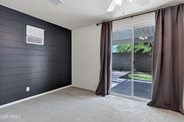 751 W Flintlock Way, Chandler, AZ 85286 - unfurnished room with wood walls, light carpet, baseboards, and ceiling fan
