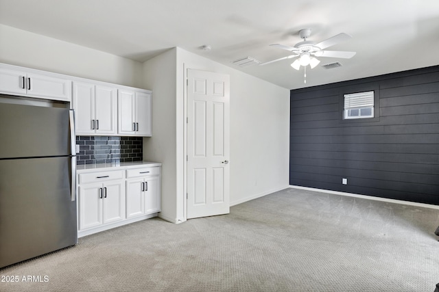 751 W Flintlock Way, Chandler, AZ 85286 - kitchen featuring freestanding refrigerator, light colored carpet, ceiling fan, and white cabinets