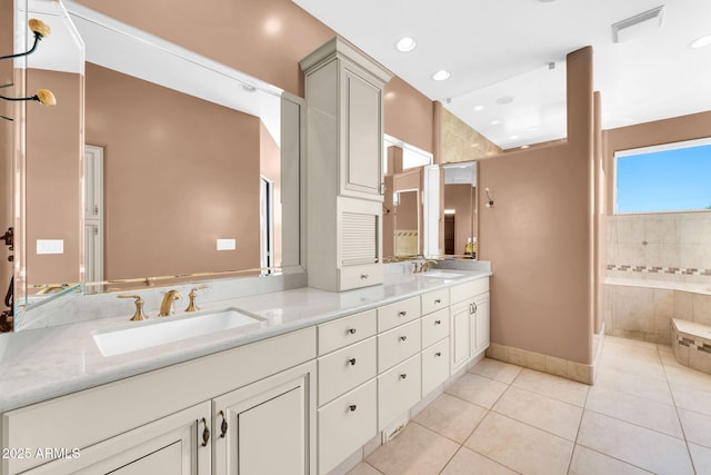 1435 E Rancho Dr, Phoenix, AZ 85014 - bathroom with double vanity, a sink, baseboards, and tile patterned floors