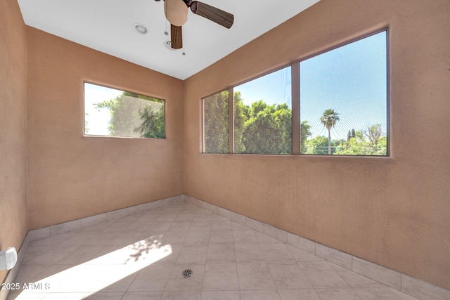 1435 E Rancho Dr, Phoenix, AZ 85014 - spare room featuring ceiling fan and baseboards