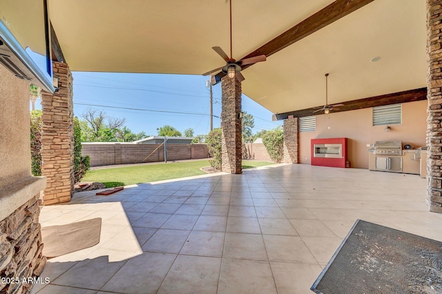 1435 E Rancho Dr, Phoenix, AZ 85014 - view of patio / terrace with a fenced backyard, a ceiling fan, a grill, and exterior kitchen