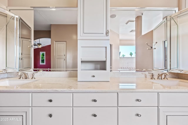 1435 E Rancho Dr, Phoenix, AZ 85014 - full bathroom featuring a sink, a shower with shower door, double vanity, and visible vents