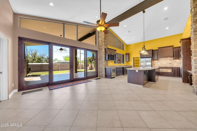1435 E Rancho Dr, Phoenix, AZ 85014 - kitchen featuring stainless steel refrigerator, high vaulted ceiling, light countertops, a ceiling fan, and backsplash