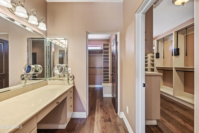 1435 E Rancho Dr, Phoenix, AZ 85014 - bathroom featuring vanity, baseboards, and wood finished floors