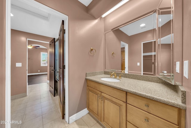 1435 E Rancho Dr, Phoenix, AZ 85014 - bathroom with tile patterned flooring, baseboards, visible vents, and vanity