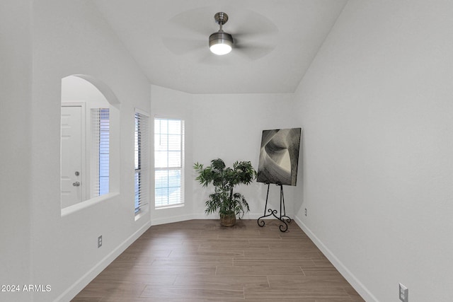 interior space with ceiling fan, lofted ceiling, and hardwood / wood-style flooring