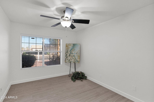 unfurnished room featuring ceiling fan and light hardwood / wood-style flooring