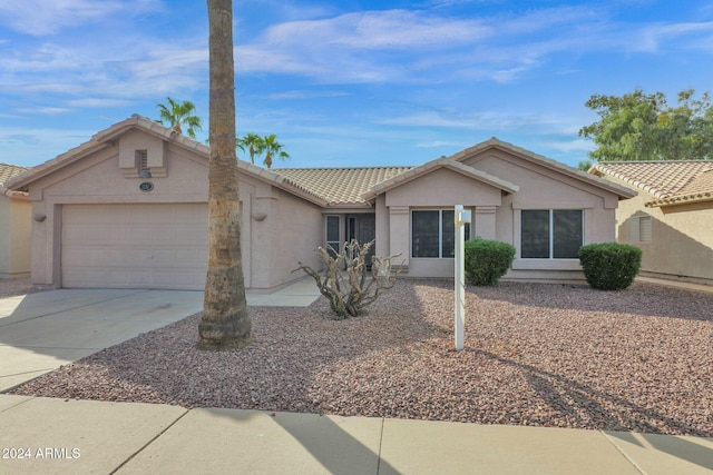 single story home featuring a garage