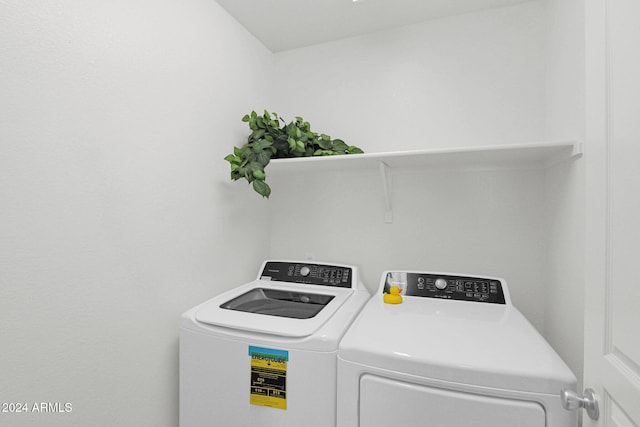 clothes washing area with independent washer and dryer