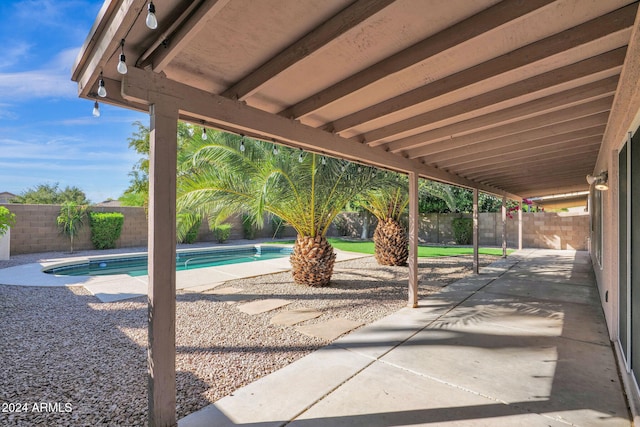 view of patio featuring a fenced in pool