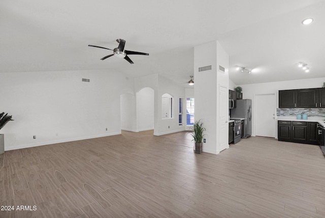 unfurnished living room with ceiling fan, light hardwood / wood-style flooring, and lofted ceiling