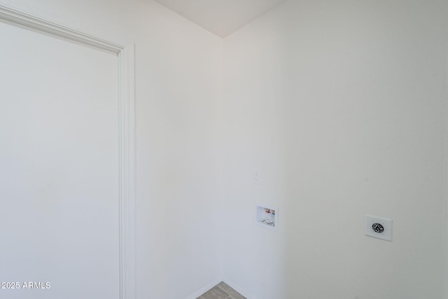 laundry room with hookup for a washing machine, electric dryer hookup, and baseboards