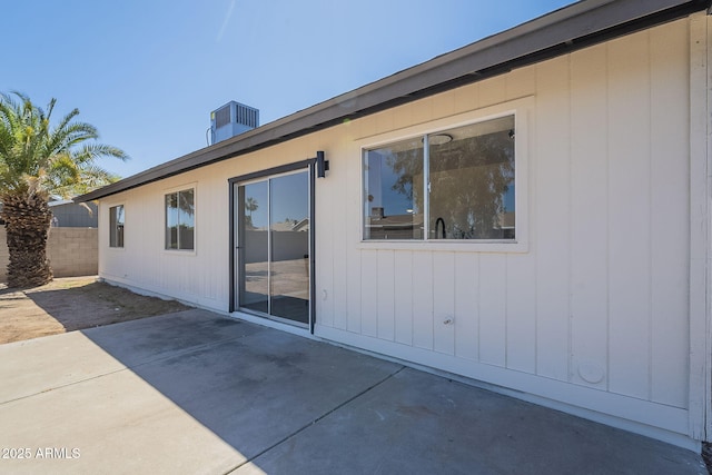 rear view of house featuring a patio and fence