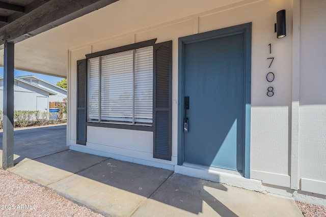 property entrance featuring covered porch