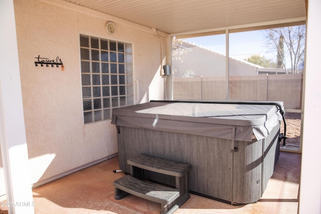 sunroom / solarium with a jacuzzi