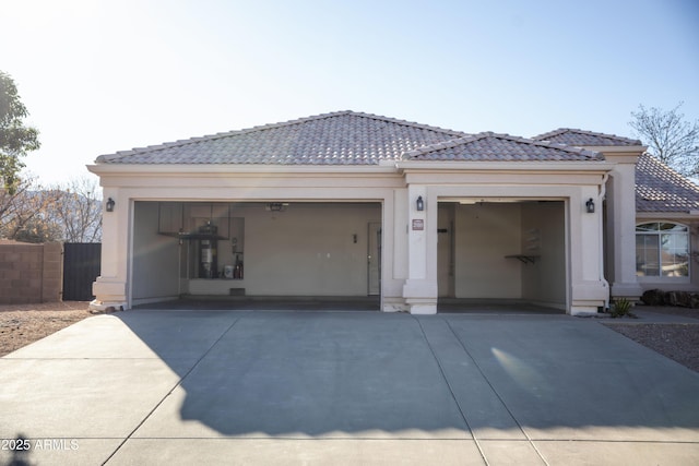 exterior space with driveway and fence